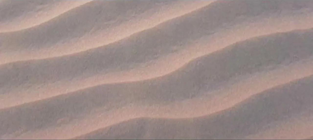 Video ad still, sand dunes