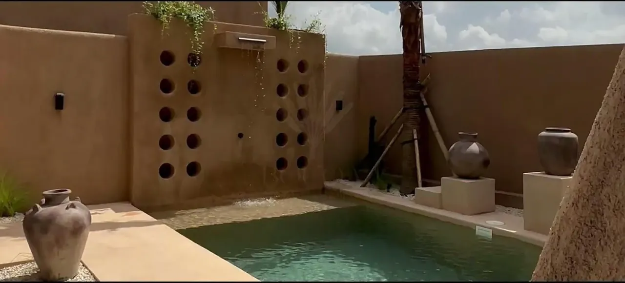 Video ad still, villa pool
