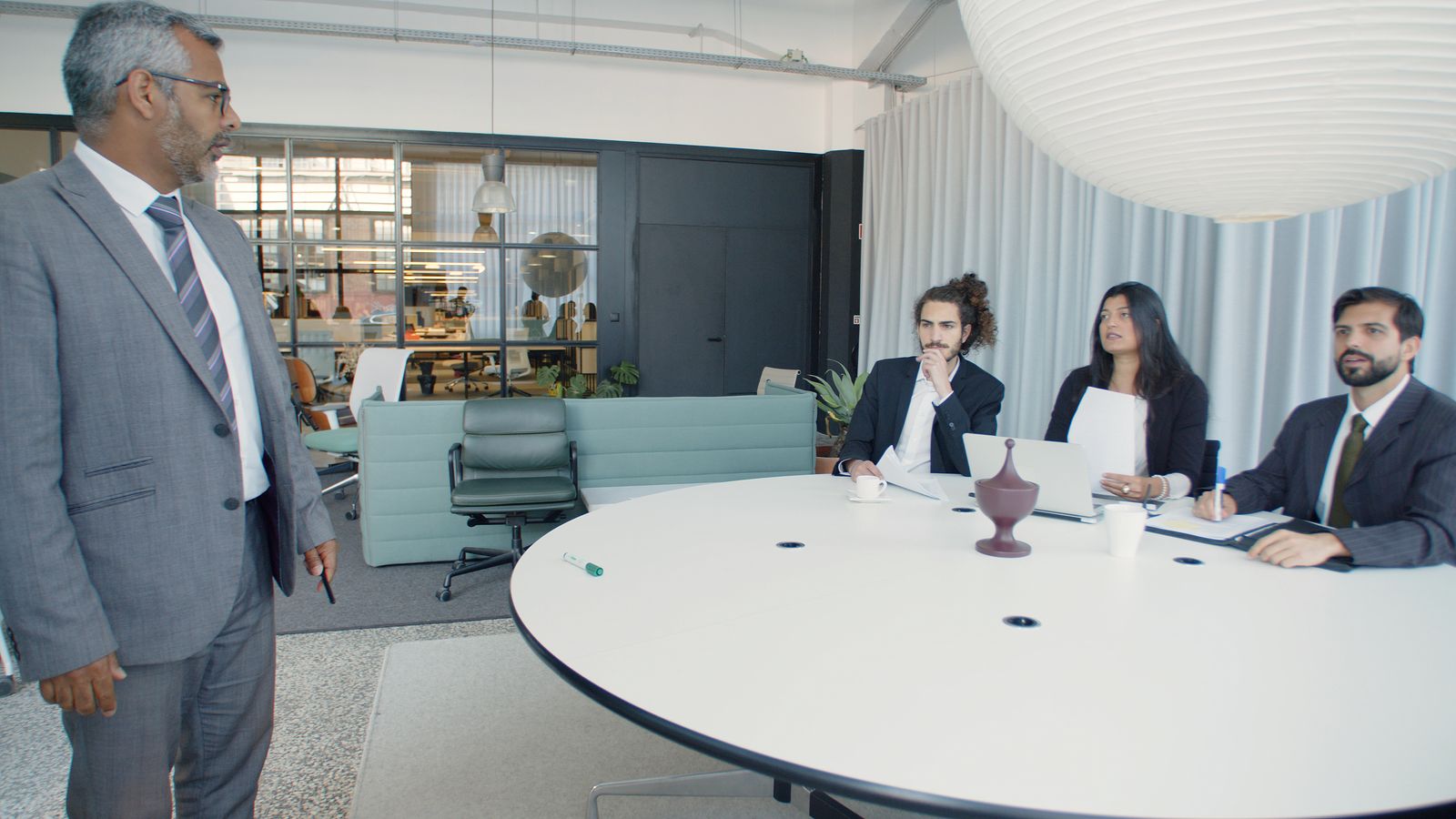 Overhead view of digital design workspace with laptops