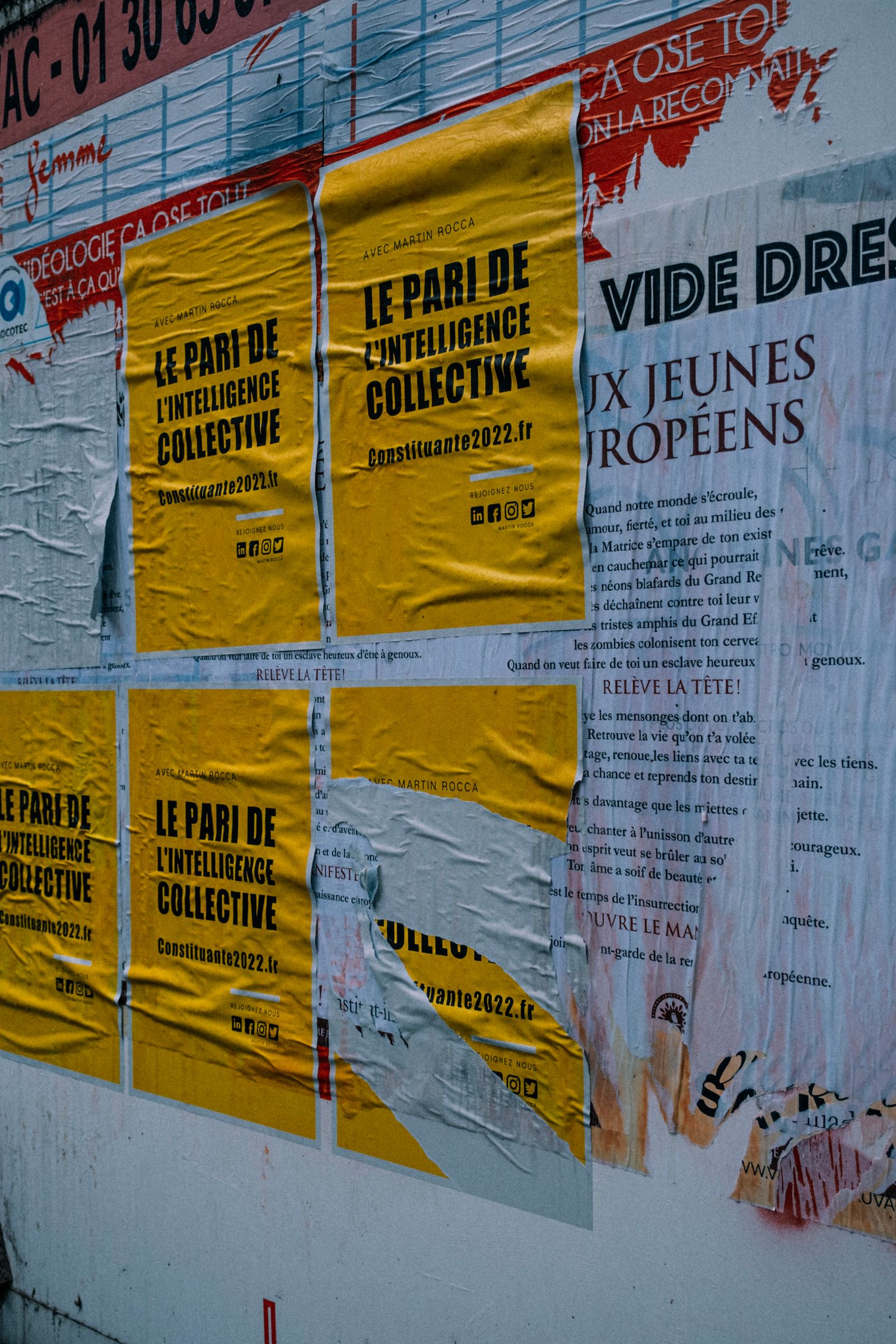 Colorful poster designs on a wall